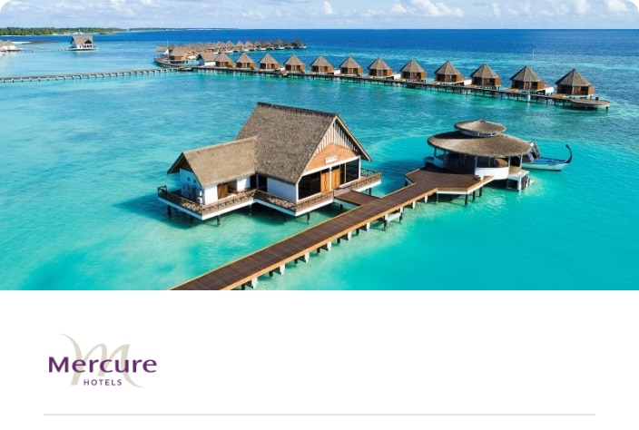 Image of over the water bungalos at the Mercure Maldives Kooddoo Resort