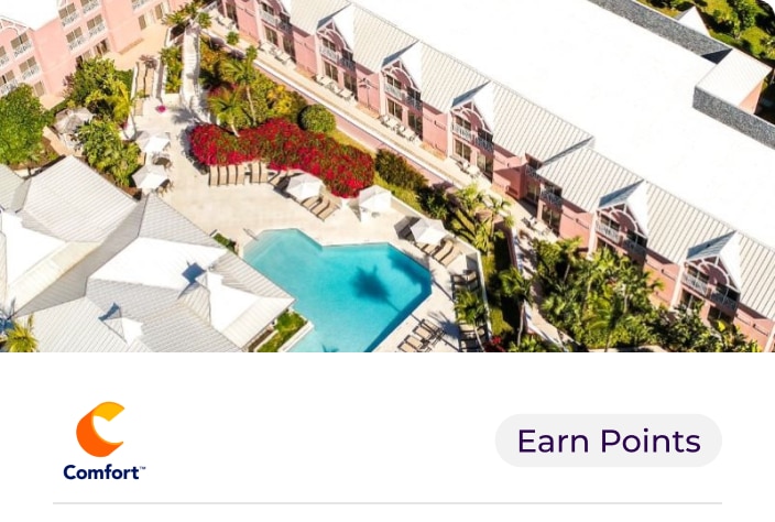 image of pink building overlooking pool