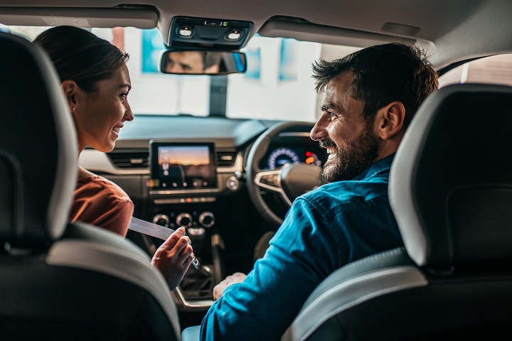 Couple inside of a car