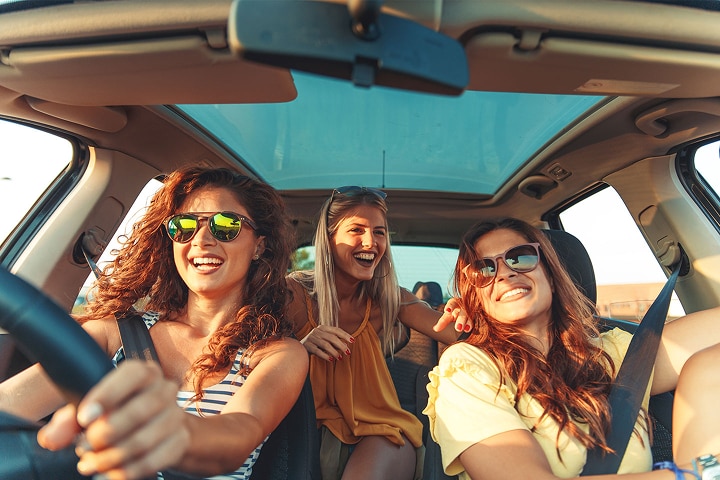 Group of friends driving in a car
