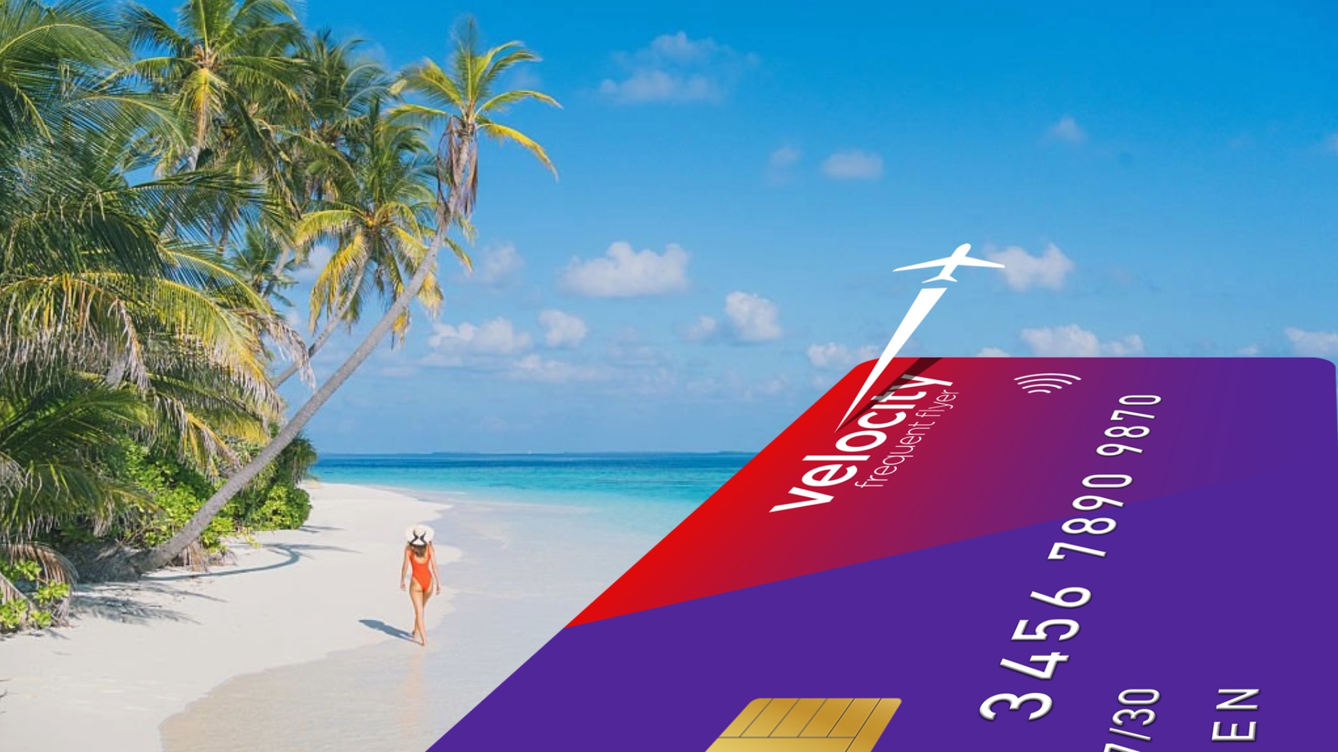 Velocity credit card with woman walking on a beach in the background
