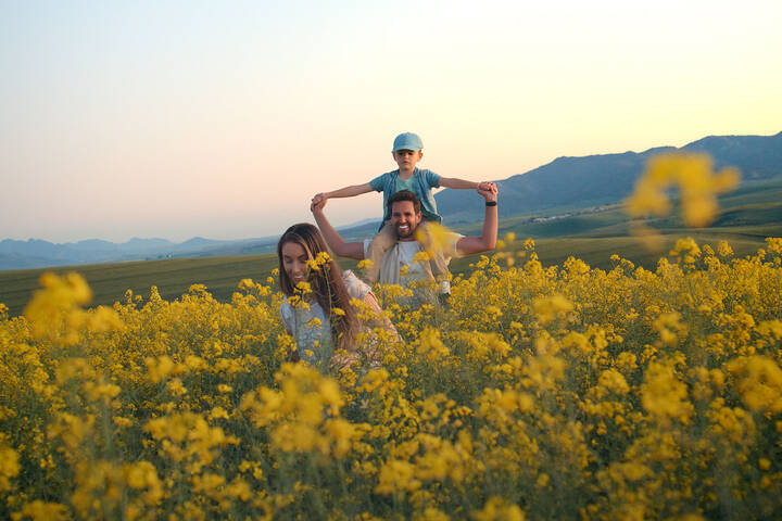 Family walking through flowers