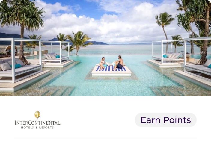 Image of two people laying in a Pool at InterContinetnal Hayman Island hotel