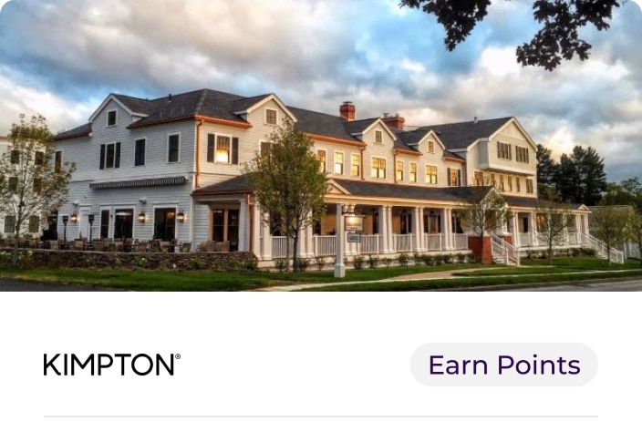 Image of the exterior of Kimpton Taconic Hotel with lans and grass