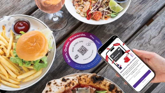 Image of a man paying for an onboard purchase