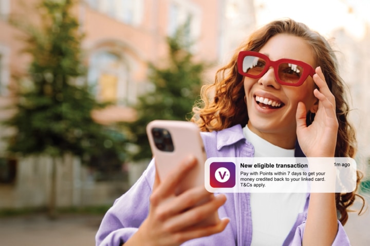 Image of a man paying for an onboard purchase