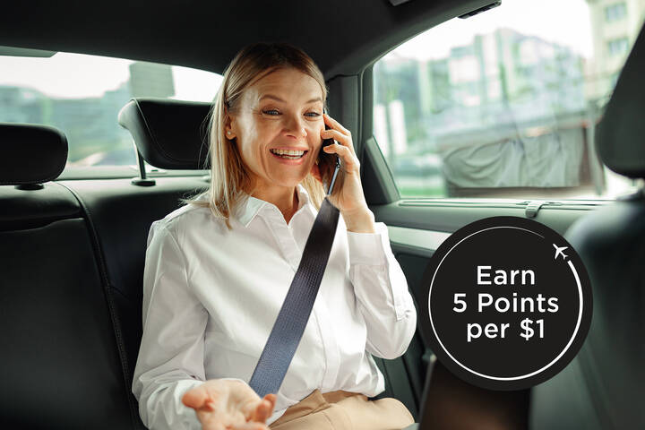 A woman in a backseat of a car