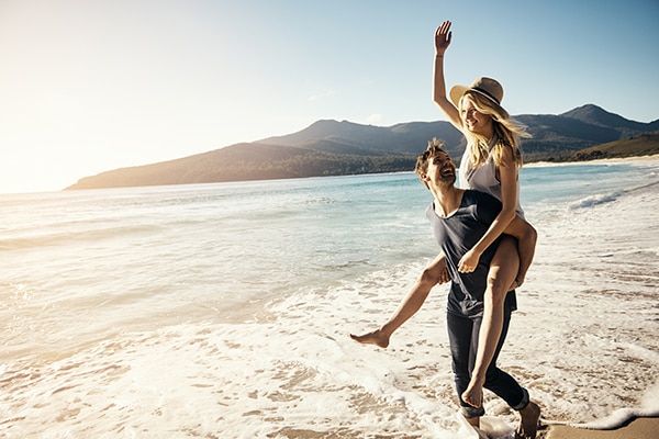Two adults enjoying life in the ocean