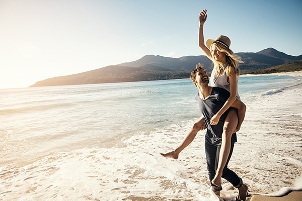 Two adults enjoying life in the ocean