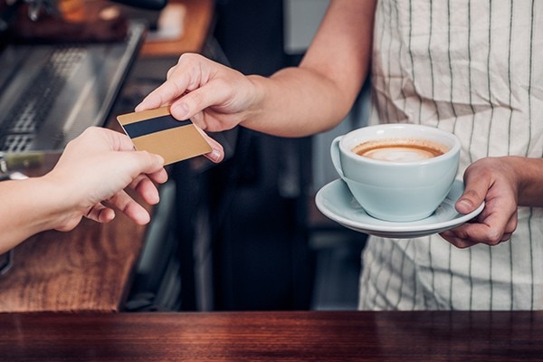 Handing a card in exchange for a coffee