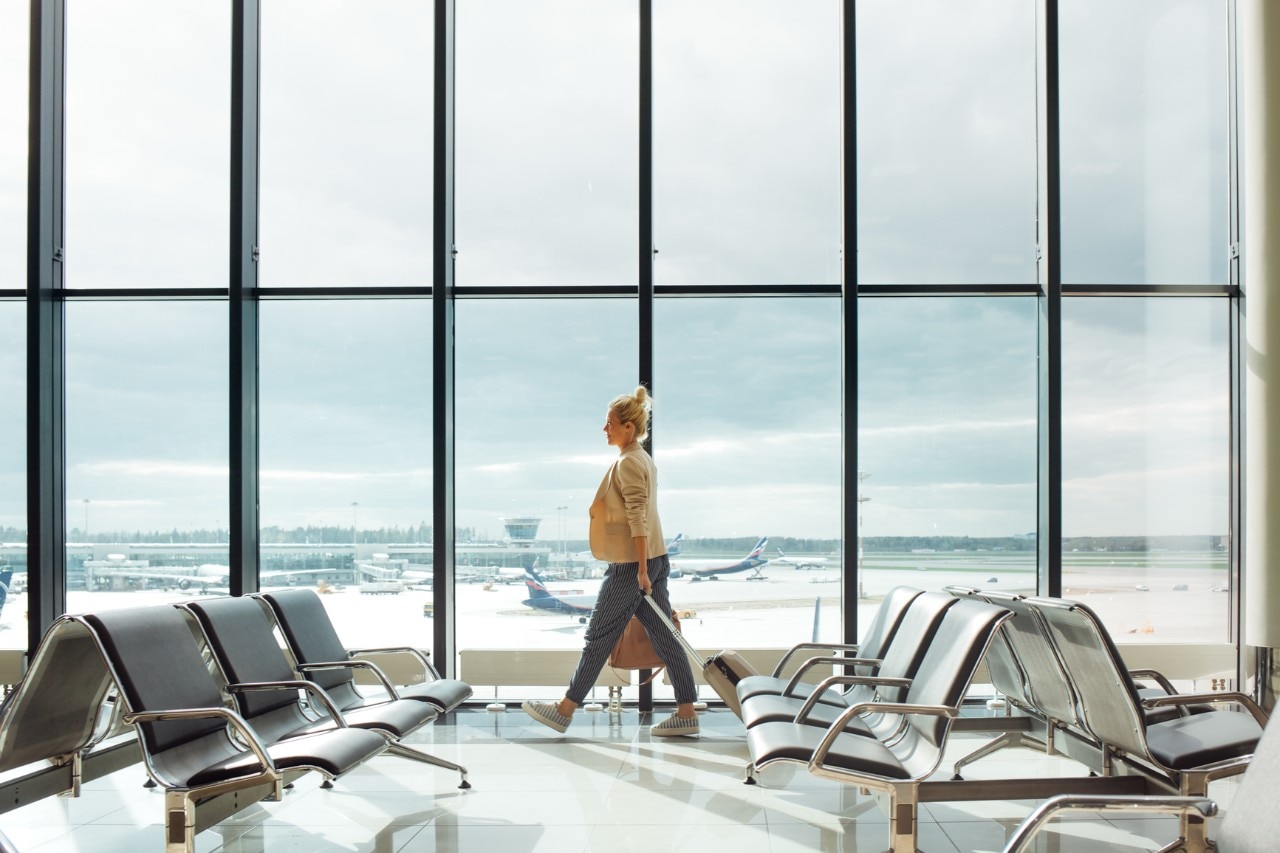 Woman walking through airport