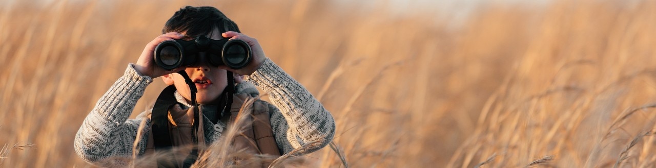 Boy with binoculars